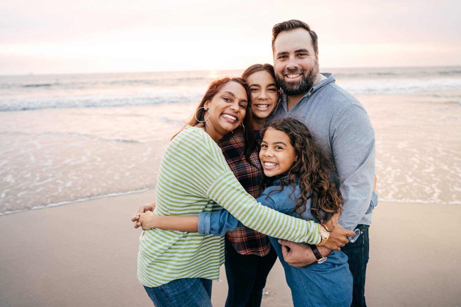 Happy family with two teen kids