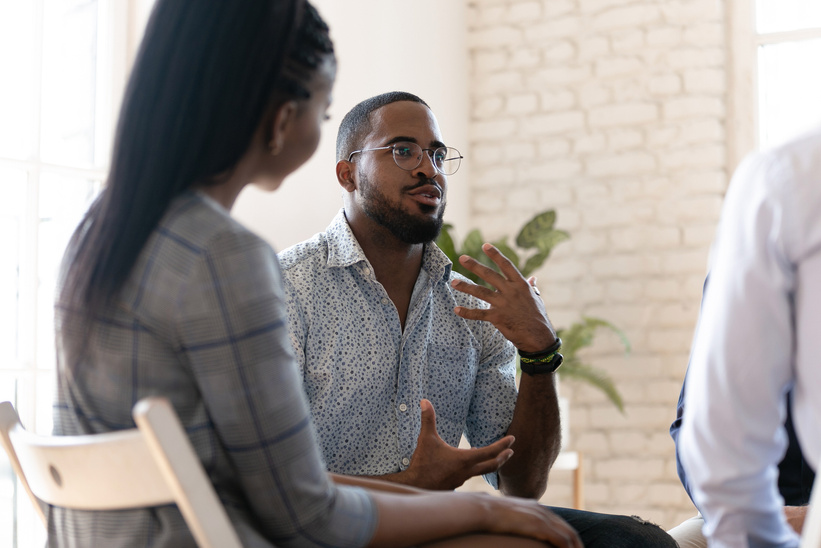 African American man speak at group therapy session